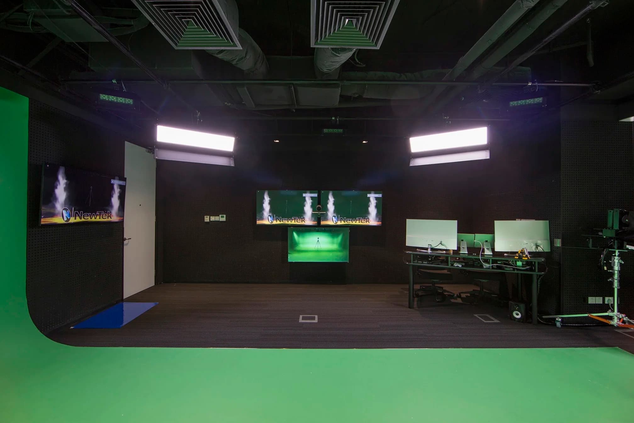 Completed Cisco Beijing studio with production lighting, cameras, presenter displays, and control positions