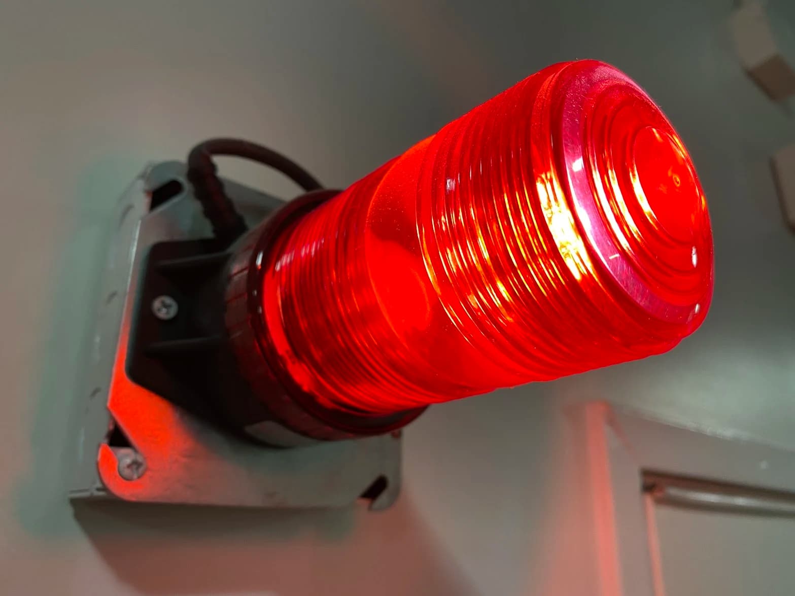 Red stage warning light mounted on a wall