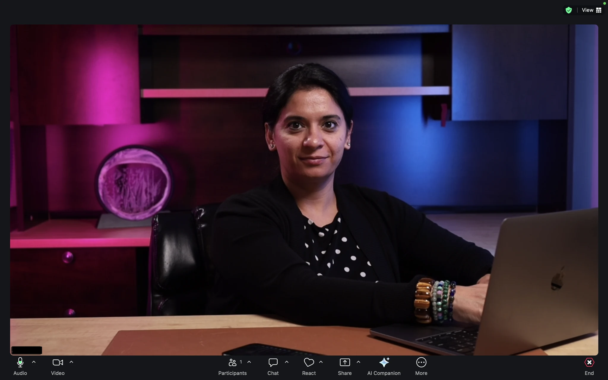 Presenter framed by colored background lighting in a Fractional Family Office video call