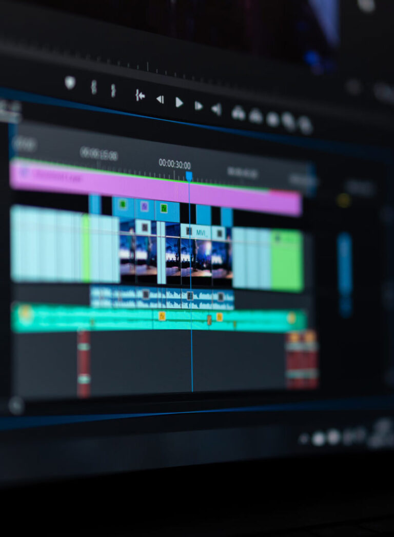 Computer screen displaying video editing in software, illustrating audio and visual production.”